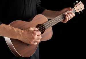 man playing tenor ukulele